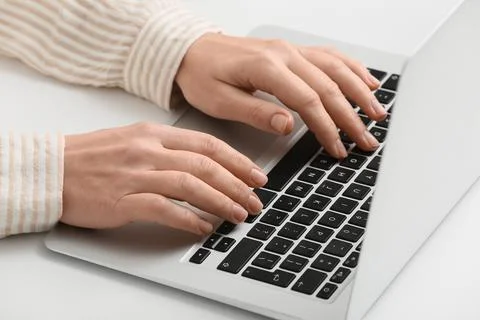 Young female programmer with laptop working in office, closeup Stock-Fotos