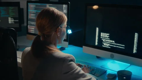 Young Female Programmer Testing Computer Code on Dark Screen Stock Footage 288792628