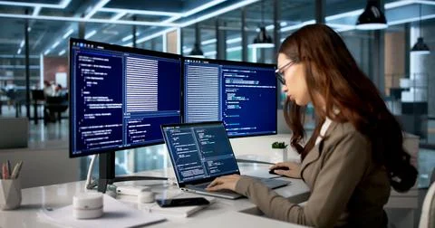 Young Female Programmer Types Code On Desktop, Developing Web Applications. Stock-Fotos