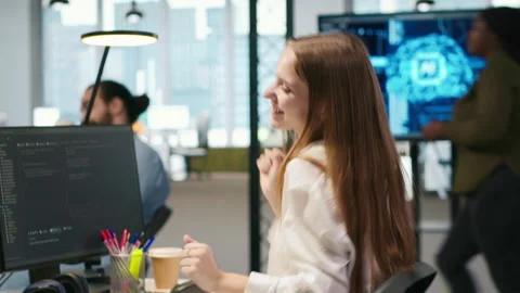 Young female programmer uses computer to write code, developing machine learning Stock Footage 313164759