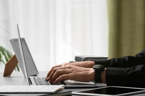 Young female programmer working with laptop in office, closeup Stock-Fotos