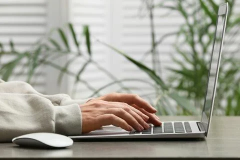 Young female programmer working with laptop in office, closeup Stock Photos