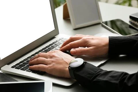 Young female programmer working with laptop in office, closeup Stock Photos