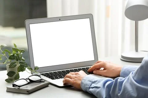 Young female programmer working with laptop in office, closeup Stock-Fotos