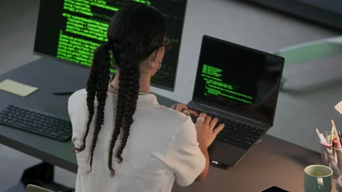 Young Female Programmer Working on Program Coding at Desk in Night Office Stock Footage 292631438