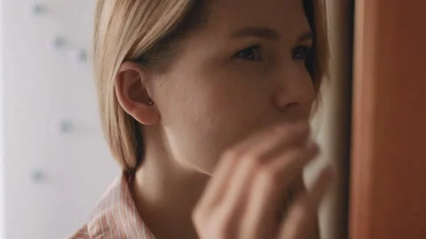 Young female pull out her hearing aid from her right ear, close up,50 fps Stock Footage 85568293