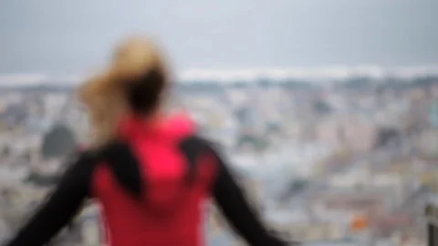 Young female runner warms up by jumping up and down on a trail overlooking the 스톡 동영상 88342168
