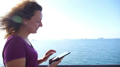 Young Female Sailing and Using Tablet Computer at Sea Видео 52518983