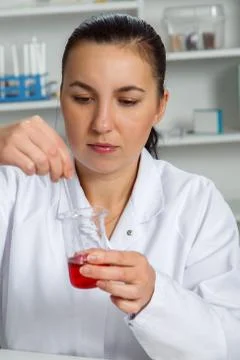 Young Female Scientist Analyzing Sample In Laboratory.laboratory assistant .. Stock Photos
