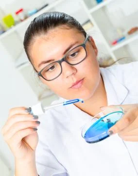 Young Female Scientist Analyzing Sample In Laboratory Stock Photos