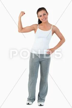 Young female showing her biceps Stock Photos