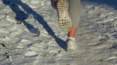 Young female stretching in the woods during morning winter workout Stock Footage 72143653