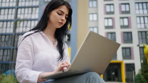 Young Female Student Working With Laptop In Park In Daytime, Businesswoman Stock Footage 252113180
