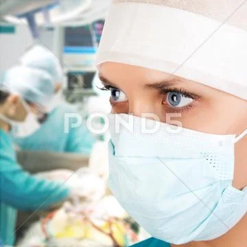 Young female surgeon in or Stock Photos