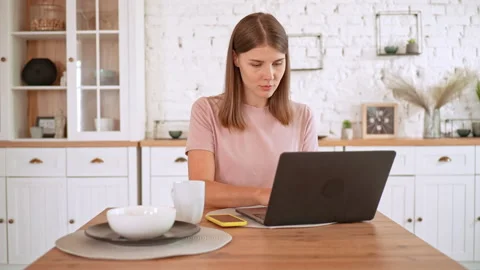 Young female using computer in flat Stock Footage 160636793