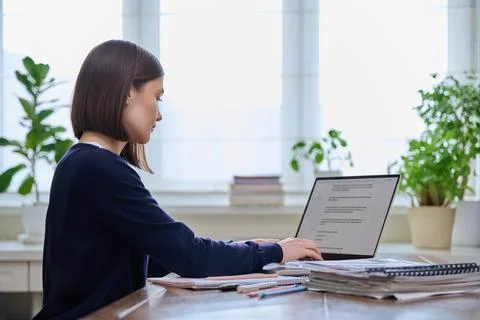 Young female using computer laptop for studying working Stock Photos