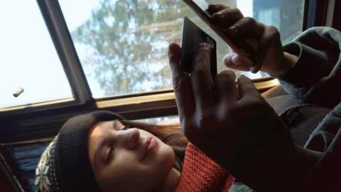 Young female using mobile to pay with credit card. Riding in a bus.  Video stock 123311072