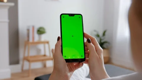 Young Female Using Smart Phone Sitting On Sofa At Home. Stock Footage 128195874