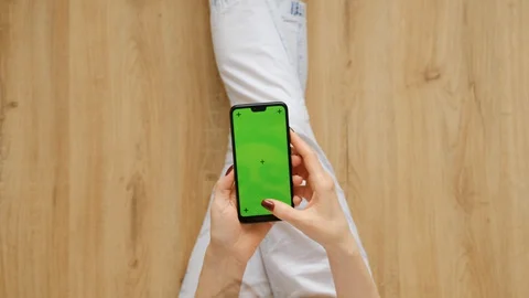 Young Female Using Smart Phone Sitting On Sofa At Home. Stock Footage 128196038
