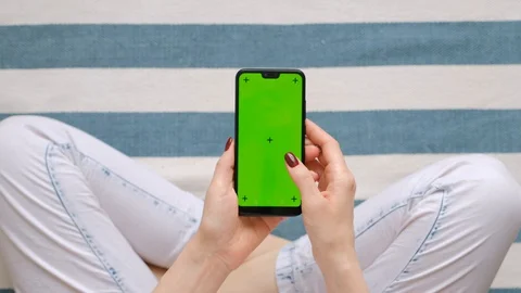 Young Female Using Smart Phone Sitting On Sofa At Home. Stock Footage 128196672