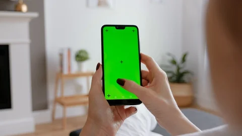 Young Female Using Smart Phone Sitting On Sofa At Home. Stock Footage 128725216