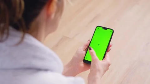 Young Female Using Smart Phone Sitting On Sofa At Home. Stock Footage 153096236