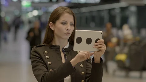 Young Female Using Tablet Screen Browsing the Internet Video stock 87733010