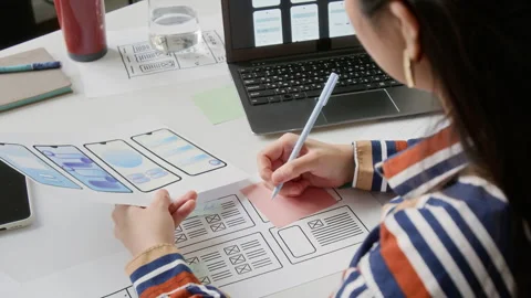 Young Female UX Engineer Working on New Wireframe Layouts Stock Footage 327904910