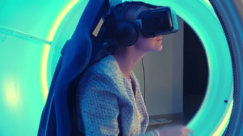 Young female in virtual reality headset selecting game for vr session Vídeos de archivo 76860729