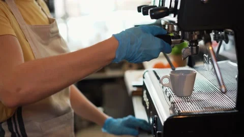 Young female working inside cafeteria bakery while making coffee Stock Footage 137440589