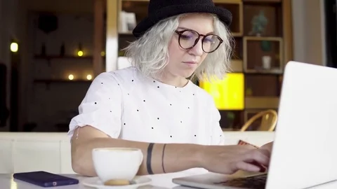 Young female working on laptop computer Stock Footage 83731606