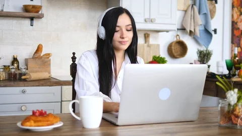 Young Female Working On Laptop Computer On Kitchen At Home Vídeo Stock 104967131