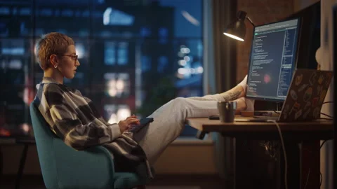 Young Female Writing Code on Computer in Loft Apartment Stock Footage 170397050
