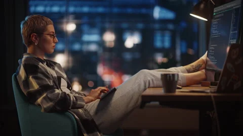 Young Female Writing Code on Computer in Loft Apartment 库存影片 170397071