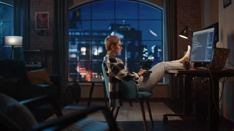 Young Female Writing Code on Computer in Loft Apartment 库存影片 170397103