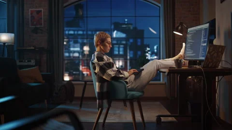 Young Female Writing Code on Computer in Loft Apartment 库存影片 170397123