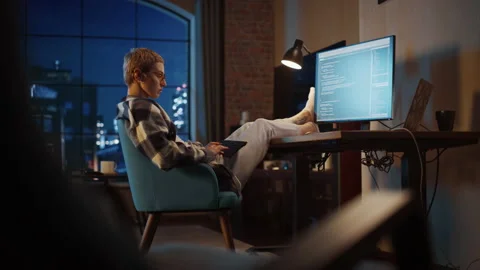 Young Female Writing Code on Computer in Loft Apartment Stock Footage 170397186