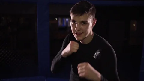 Young fighter he is looking at the camera and gets ready for battle Stock Footage 71663128