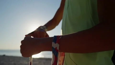 Young fighter wraps her hands with boxing bandages, kickboxing training outdoor Видео 210720151