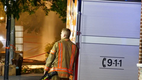 A young firefighters on-scene Stock Footage 115938958