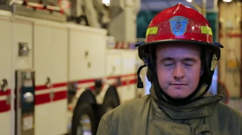 Young fireman wiping sweat from forehead, portrait Stock Footage 66548760