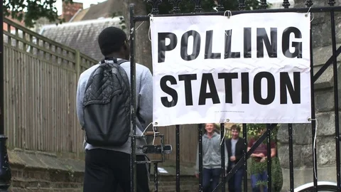 Young First Time Voters at Polling Station in UK Election Stock Footage 76434966