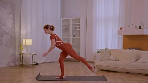 Young fit athletic trainer doing pilates and fitness exercises Stock Footage 255862582