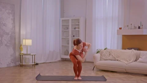 Young fit athletic trainer doing pilates and fitness exercises Stock Footage 255862592