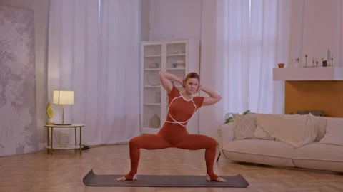 Young fit athletic trainer doing pilates and fitness exercises Stock Footage 255862595