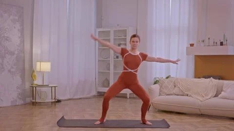 Young fit athletic trainer doing pilates and fitness exercises Stock Footage 255862601