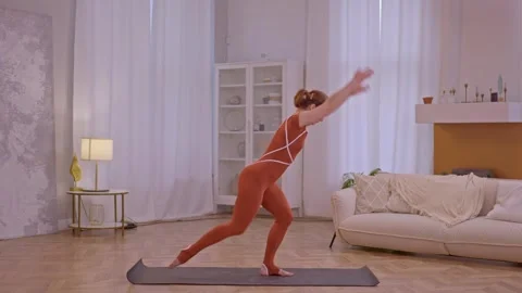 Young fit athletic trainer doing pilates and fitness exercises Stock Footage 255862610