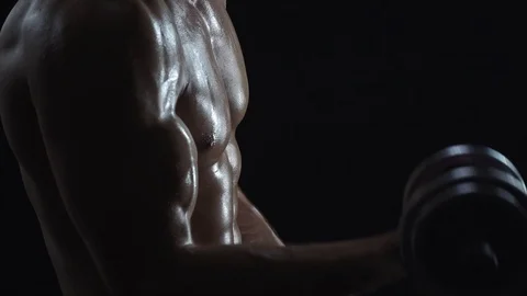 Young fit guy doing biceps curls Stock Footage 109501024