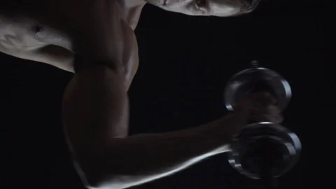 Young fit guy doing dumbbell press Stock Footage 108951625