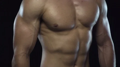 Young fit guy shows biceps Stock Footage 109501262